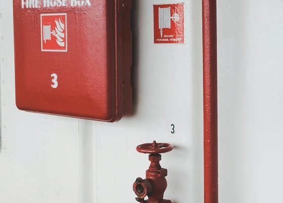 Red fire emergency shut off box and red valve handle